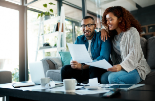 Couple reviewing their homeowner policy checklist
