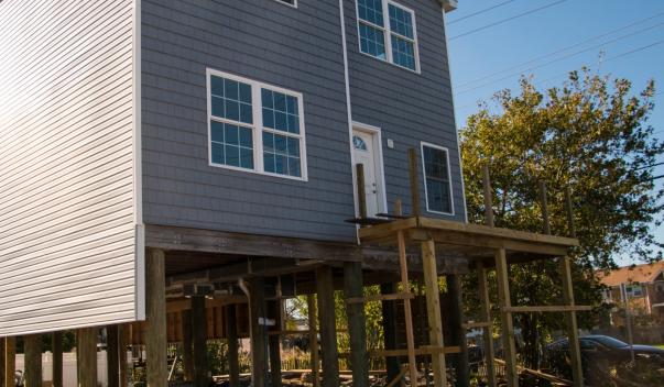 Image of a house being modified to be elevated to get a discount on cost of flood insurance