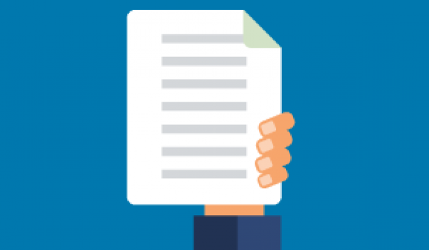 Hand holding up documents