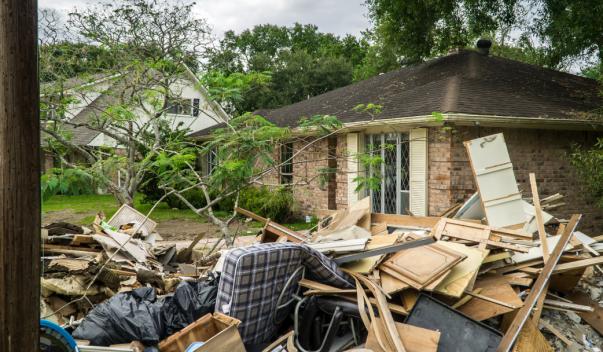 Post-flood debris piled up outside of house